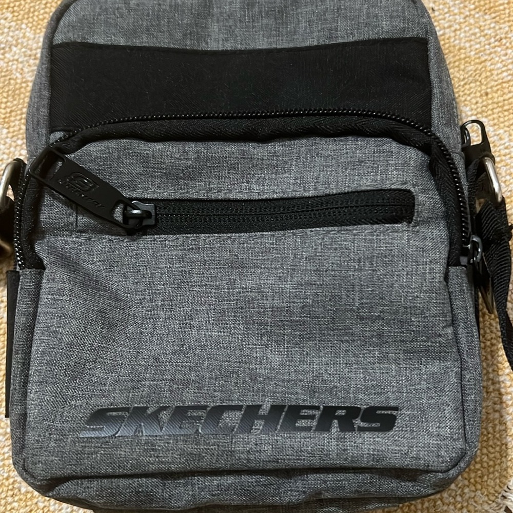 Used one time, has 3 pockets with zippers.